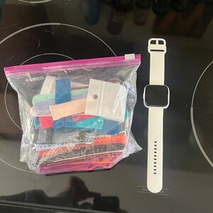 Fitbit Smartwatch with White Band and Colorful Straps